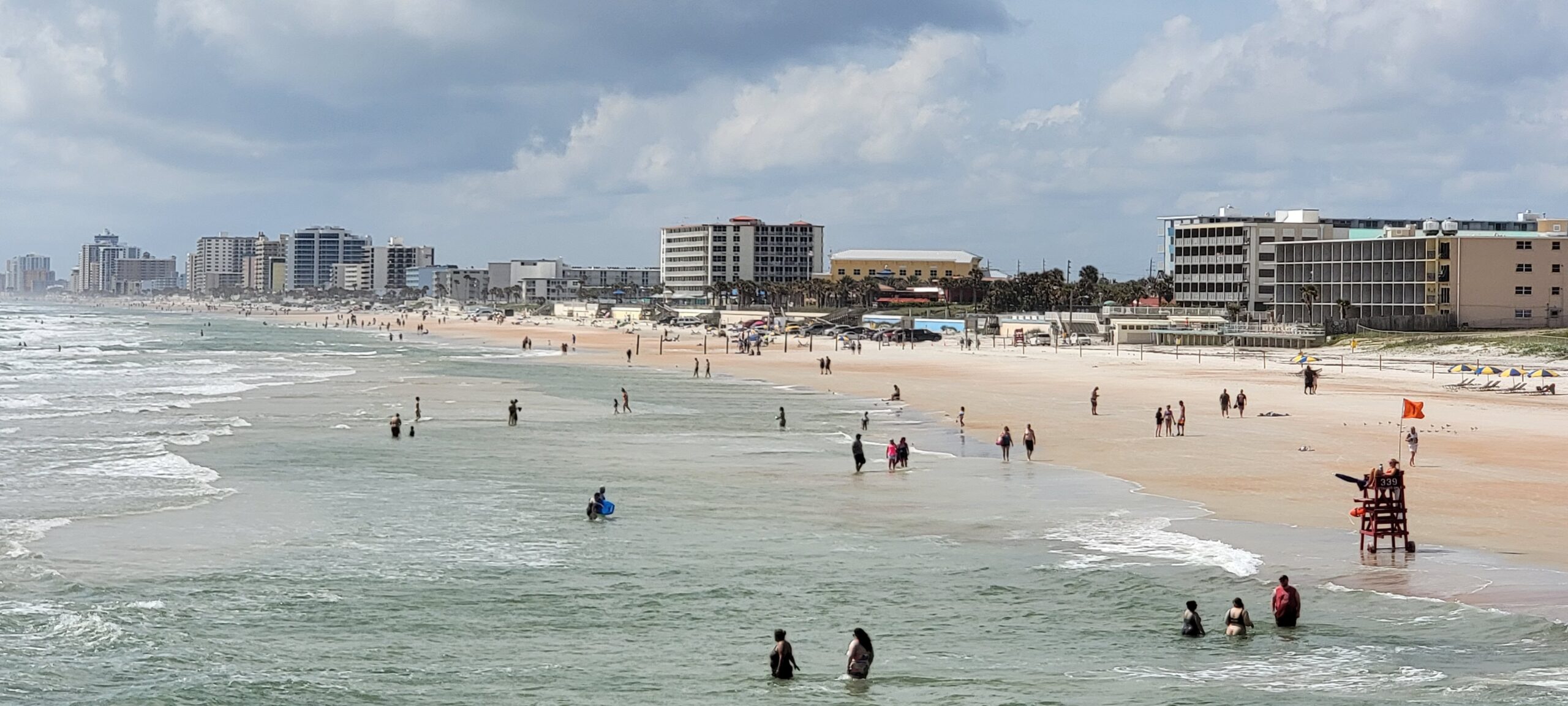 People wading in the surf at Daytona Beach, Florida