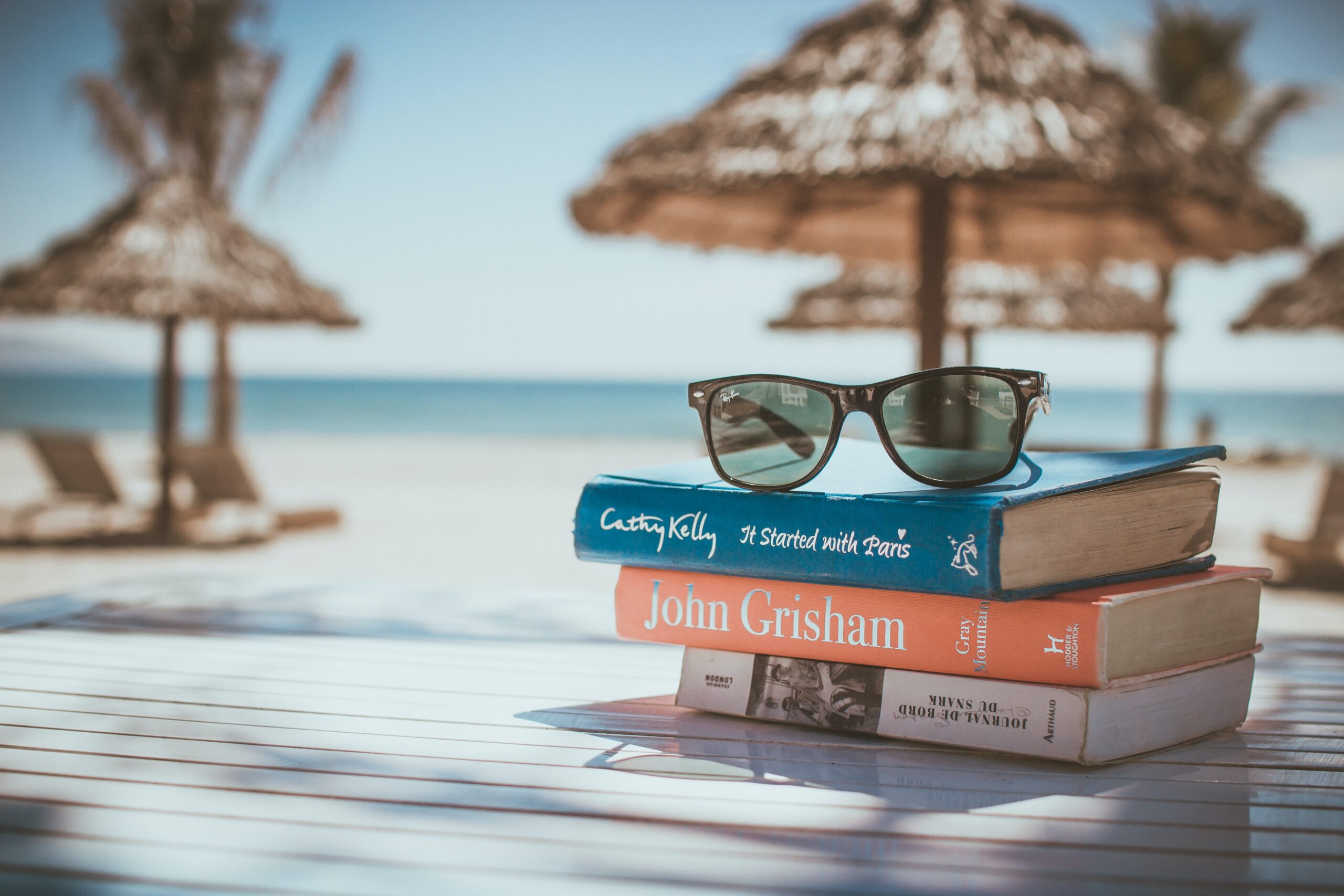 books under beach umbrella